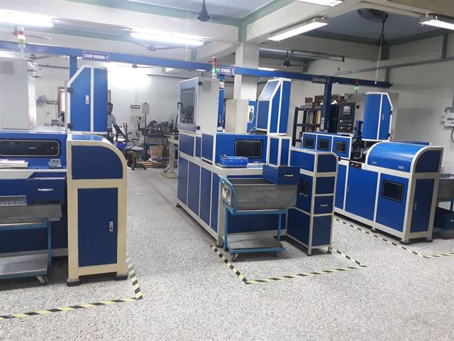 Close view of a toroidal core winding machine