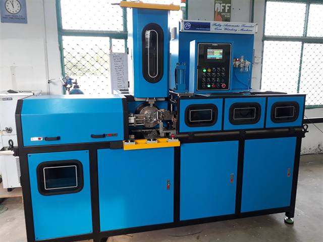 Toroidal core winding machine in operation